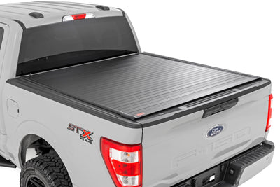 Rough Country Hard Roll Up Bed Cover for Ford F-150 15-26 with 5'7" Bed — installed at Road Runner Wheels & Tires · primary view