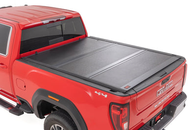 Rough Country Hard Low Profile Bed Cover for Chevy/Gmc with 6'9" Bed — installed at Road Runner Wheels & Tires · primary view